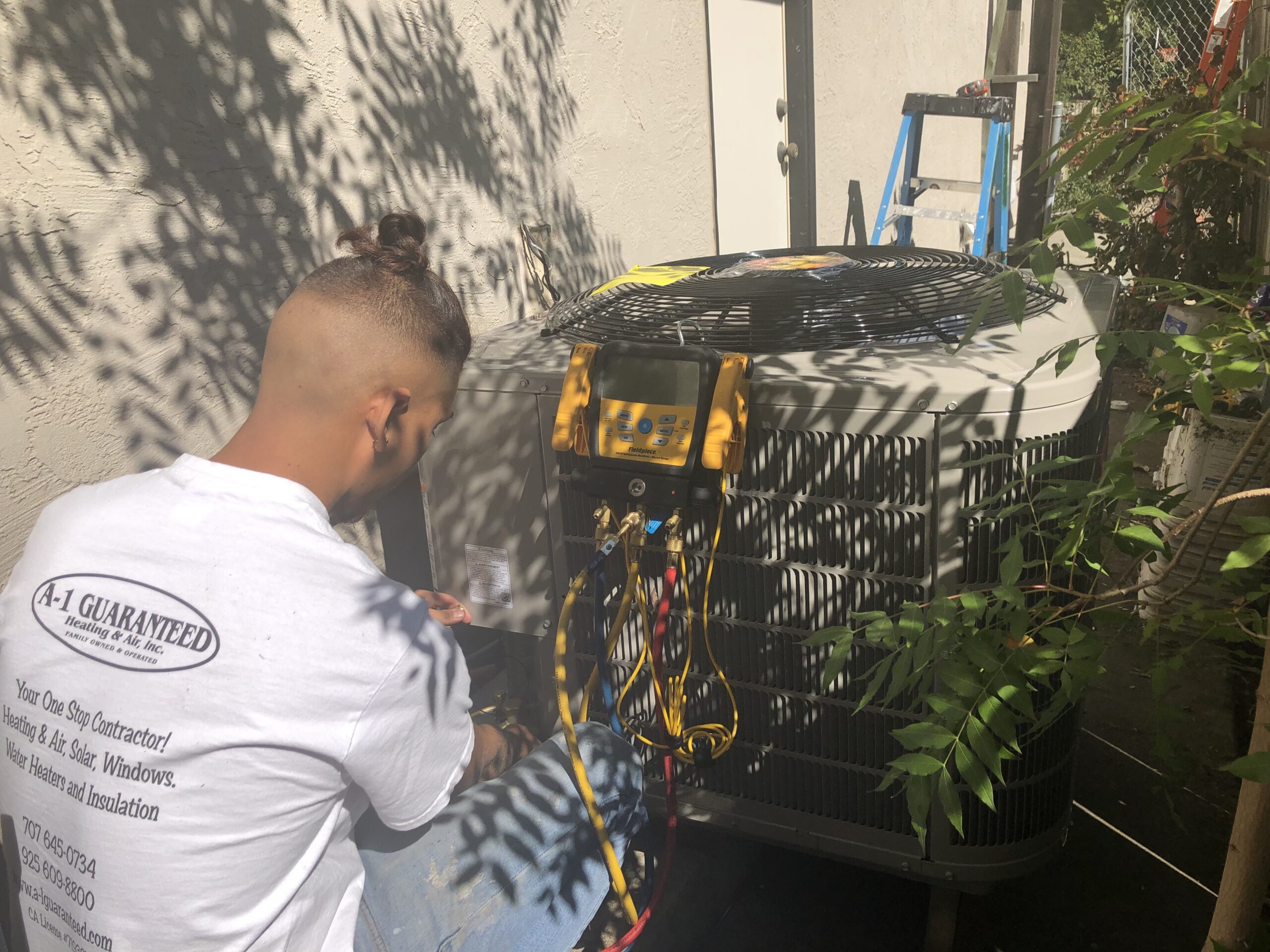 A-1 Guaranteed team member testing heat pump